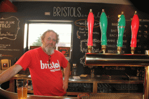 Bristols Cider owners Neil Collins owner behind the counter at his Atascadero cider house. Photo by Heather Young