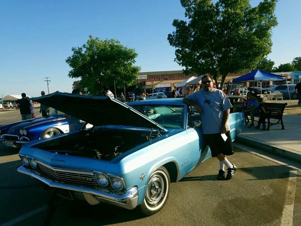 Ralph Garcia with his 1966 Chevy Impala Super Sport.
