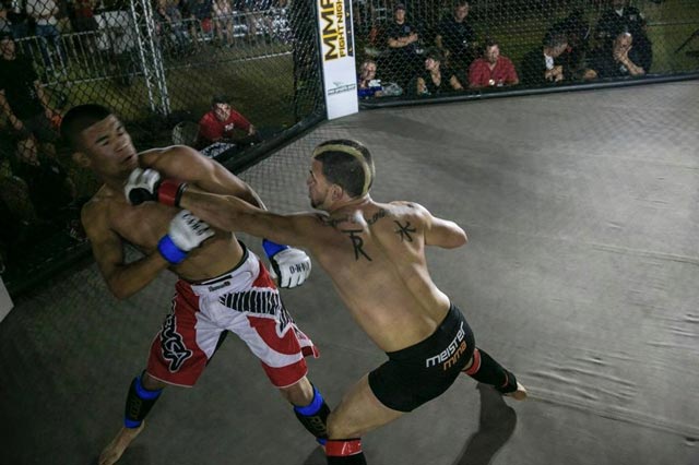 Chris Elisarraras takes a swing at opponent Daniel Robles.