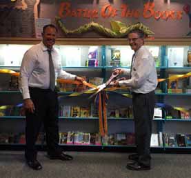Paso Robles Joint Unified School District Superintendent Chris Williams joins Mayor Steve Martin at the Library during a ribbon-cutting ceremony to official open nearly 400 new Battle of the Books collection materials.