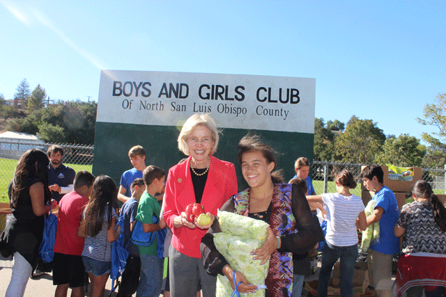 United States Rep. Lois Capps stands with a studen at the Boys and Girls Club's first Kids' Farmers' Market on Oct. 24. Photo by Heather Young
