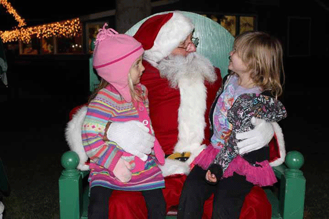 Santa talks to two children at the 2013 Winter Wonderland event. Photo by Heather Young