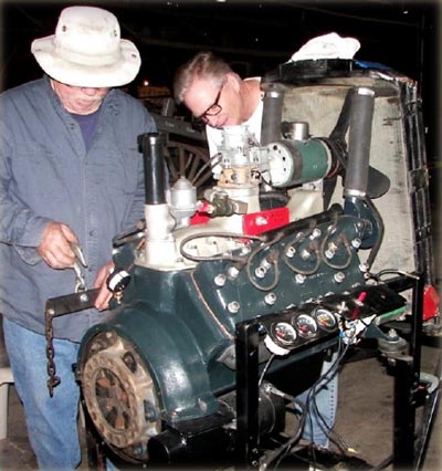 Volunteers prepare a 21 Stud Ford Flathead engine for insertion into the chassis of the 1933 school bus the Templeton Historical Museum Society is refurbishing. Photo © Soaring Eagle Press 2014; All Right Reserved