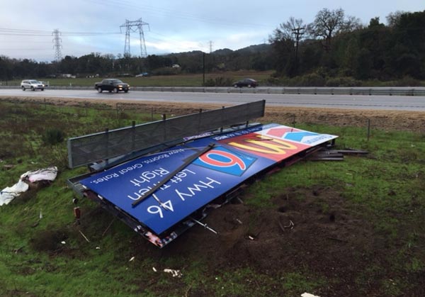 wind knocks billboard down