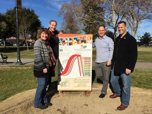 REC Foundation board members Cindy Paup, Steve Fleury and Randal Moos accept a $5,000 donation from Eric Osborn of Osborn Insurance Services (2nd from right) for the Downtown City Playground Project in Paso Robles.