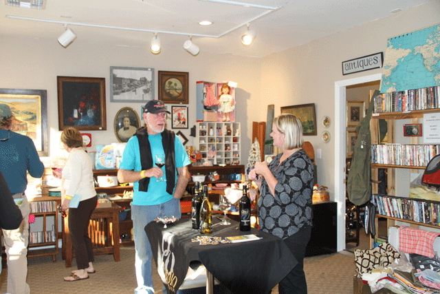 Anne Paulson of Opolo Winery chats with a wine taster inside 805 Vintage and Thrift on Friday. Photo by Heather Young