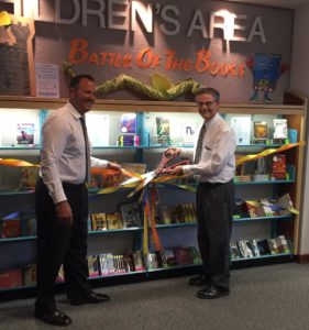 Paso Robles Superintendent of Schools Chris Williams and Paso Robles Mayor Steve Martin unveiling the children’s book collection at the City Library funded by a $2,500 donation from the Masonic Lodge and the Order of the Eastern Star.