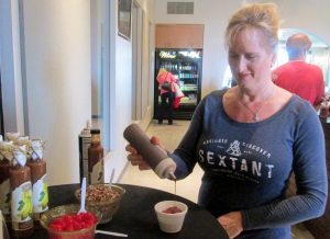At Sextant Wines' self-serve Sundae bar, Heather Nocket drizzles the ice cream with a Zinfandel-reduction fudge sauce