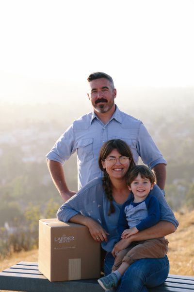 The Larder Meat Company co-owners Chef Jensen Lorenzen and Grace Lorenzen with their son. Photo by Kendra Aronson.