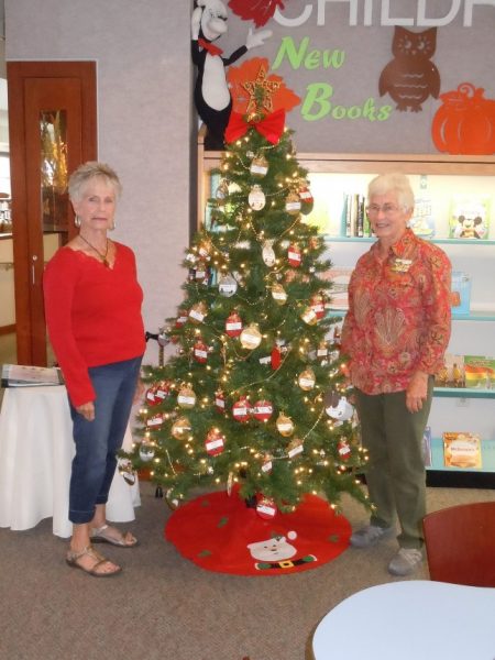 Foundation member Sally Martinus and library volunteer Jean Hayward enjoy our freshly decorated Giving Tree.