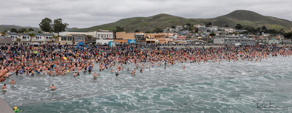 Thousands attended the annual dip in Cayucos. Photo by Rick Evans. 