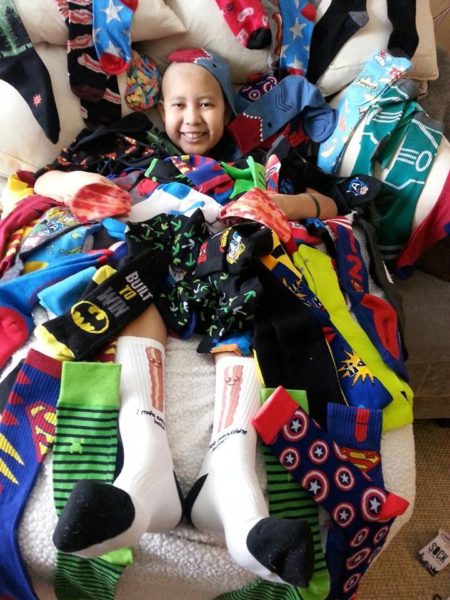 A photo of Josh from a Sock Drive held at San Benito Middle School.