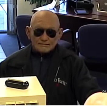 man robs bank with old man mask