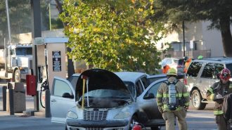 Crews extinguish vehicle fire in 7/11 parking lot