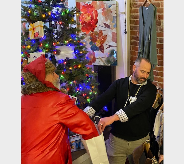 Santa Claus drew the winning ticket from several hundred entries.