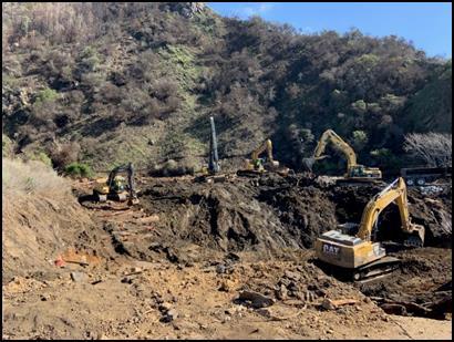 Excavators removing debris from the canyon February 11