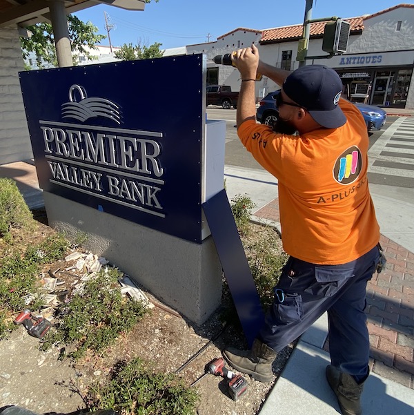 Local bank receives new signage, new name