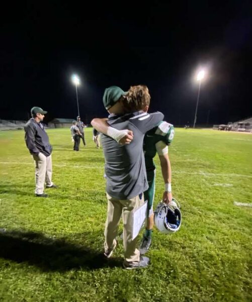 Coach Crow hugs a players at season's end