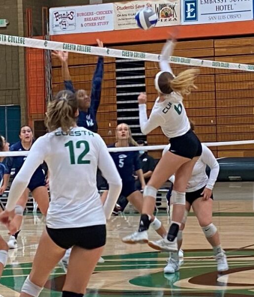 Morgan Krause hits it over the net
