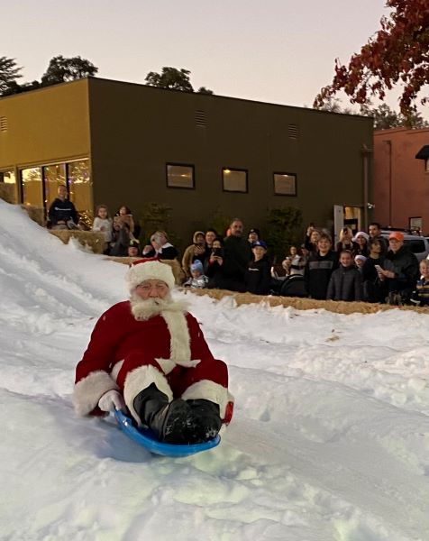 Santa Slides down slope