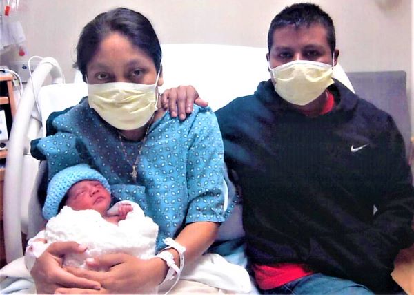 Jorge Luis and Family -- First Baby of New Year at Twin Cities