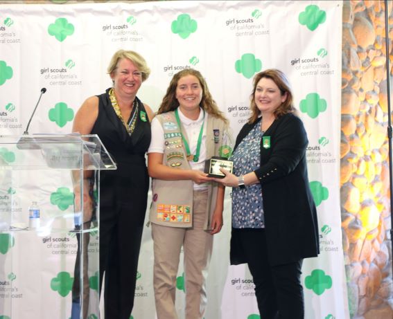 SCCC CEO Tammie Helmuth, Girl Scout of the Year Veronica Vetter, and Board Chair Raina Knapp