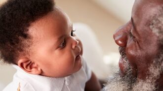 stock image grandpa holding baby