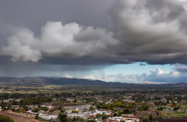 DALL·E generated image - Rain clouds over the city of Paso Robles California