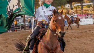 Photo information: Poly-Royal-Rodeo.jpg — 2022 Rodeo Queen Megan Sharp rides the arena prior to the competition.