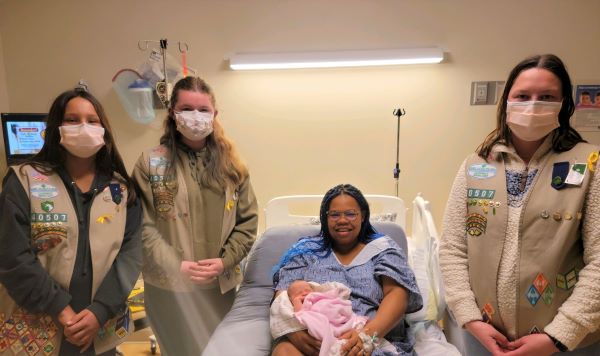 Girl Scouts donate supplies to first baby girl born during National Girl Scout week