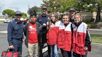 Paso Robles High School club members Alonso Mendoza, Maddie Williams, Lexi Keller, Hanna Fregang with local first responders.