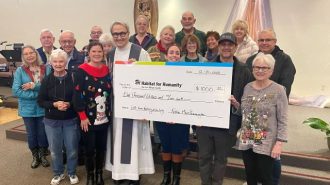 Local Catholic church donates to Habitat for Humanity