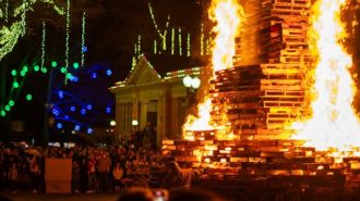 a 20-foot-tall tower of wood pallets that was set ablaze as the central spectacle