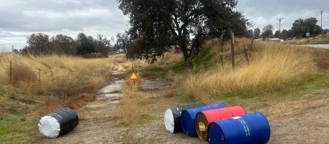 Barrels of hazardous waste dumped along public roadway in Paso Robles